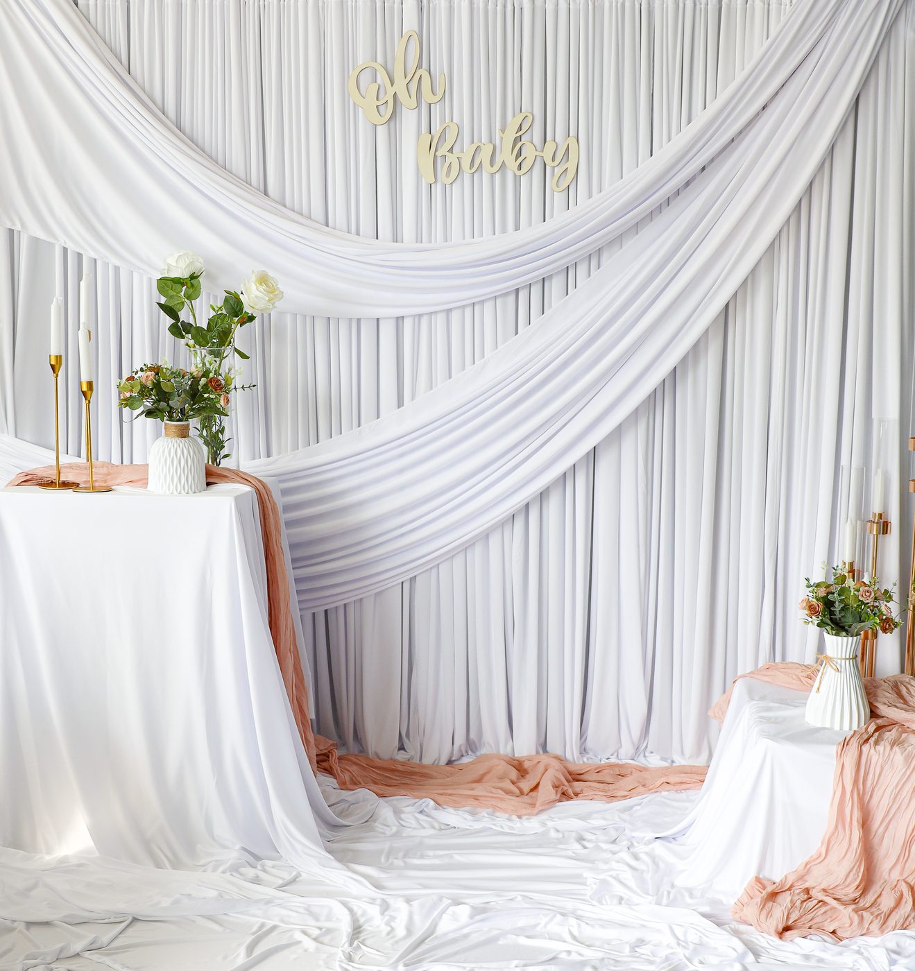 Styled set with white drapes and fresh flowers